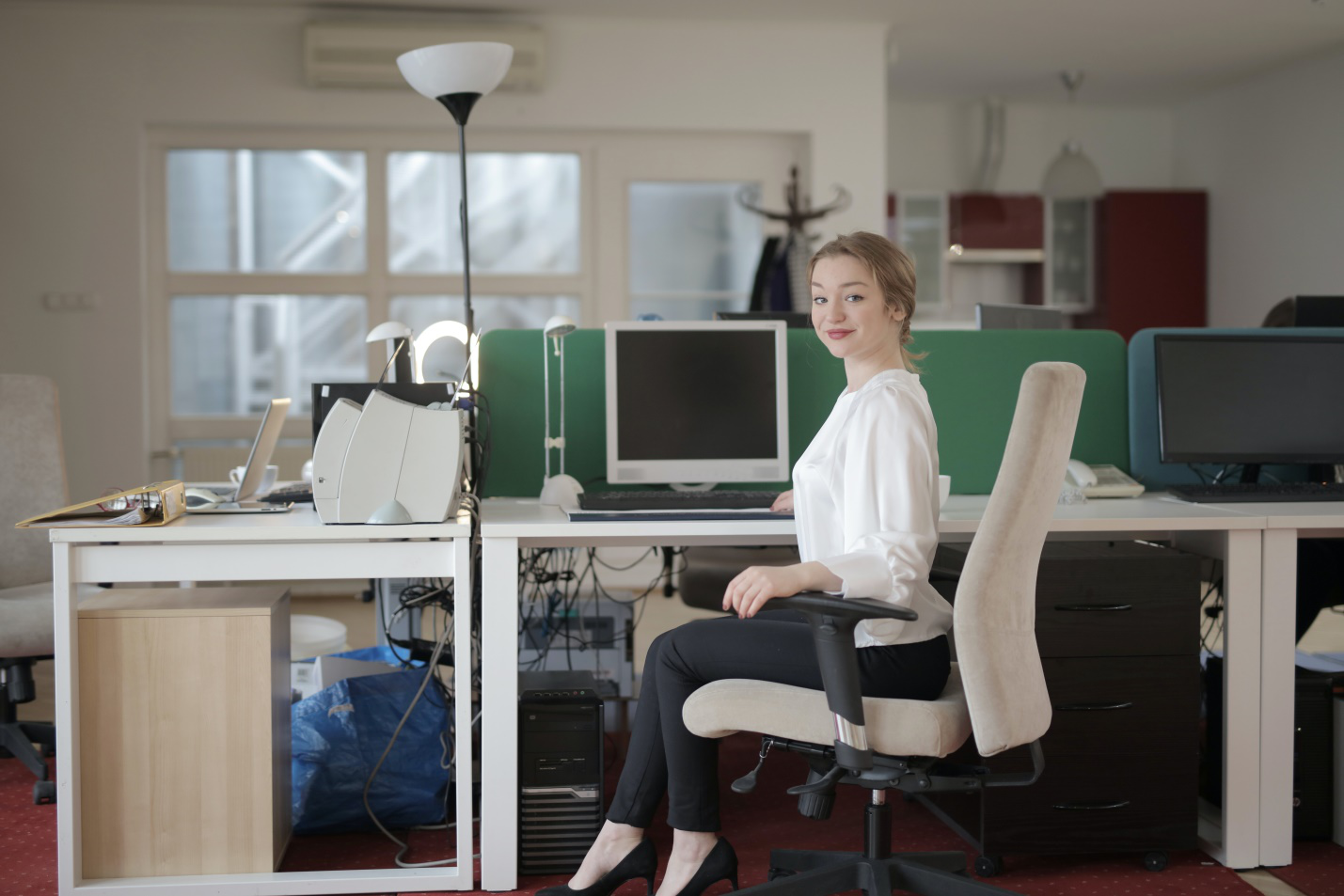 A girl sitting in an office