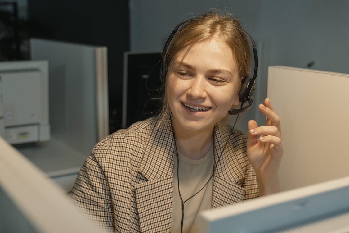 A woman at a phone answering service center