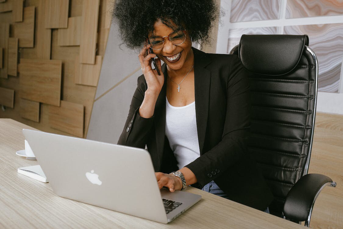 Woman sitting on a chair talking on the phone